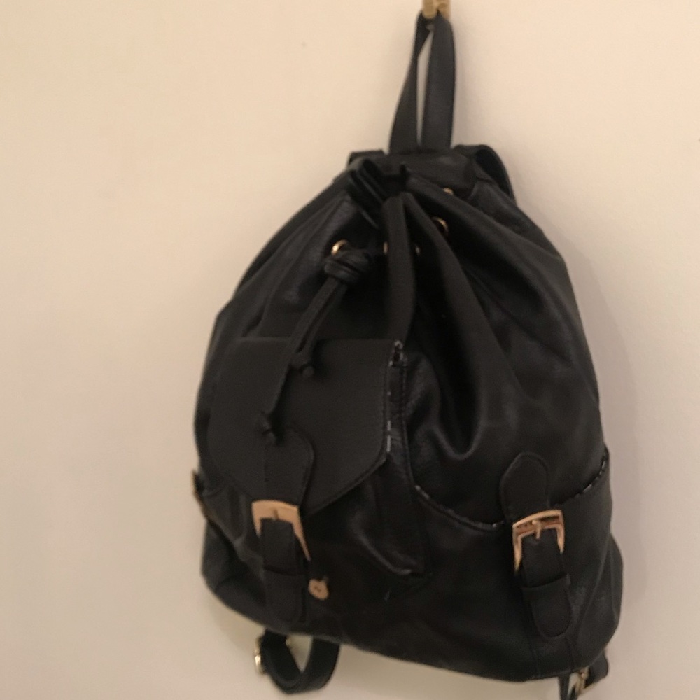 Black Leather backpack with gold buckles